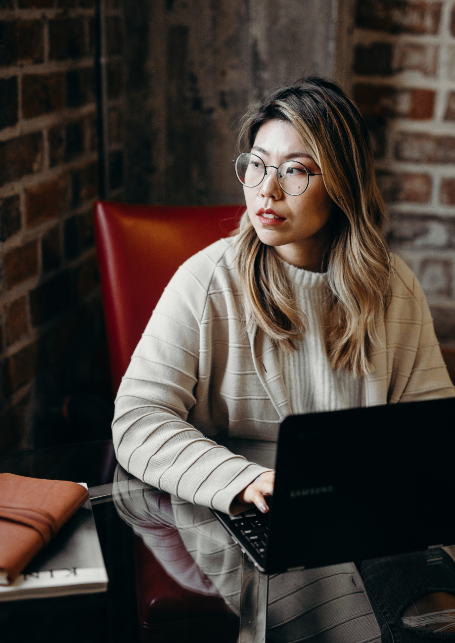 nonbinary trans man standing outside with a bicycle