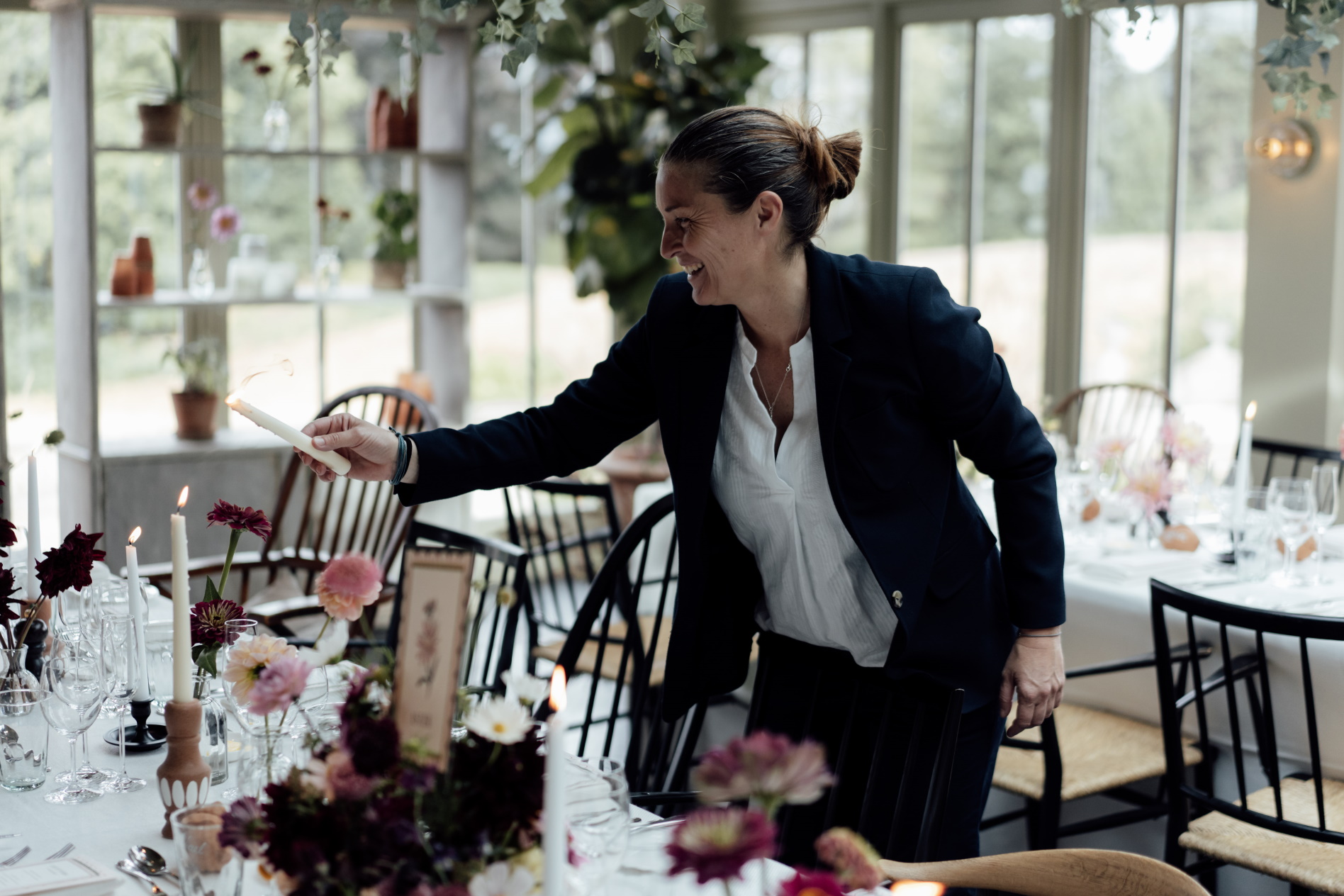 Female employee lighting candles at a ceremony