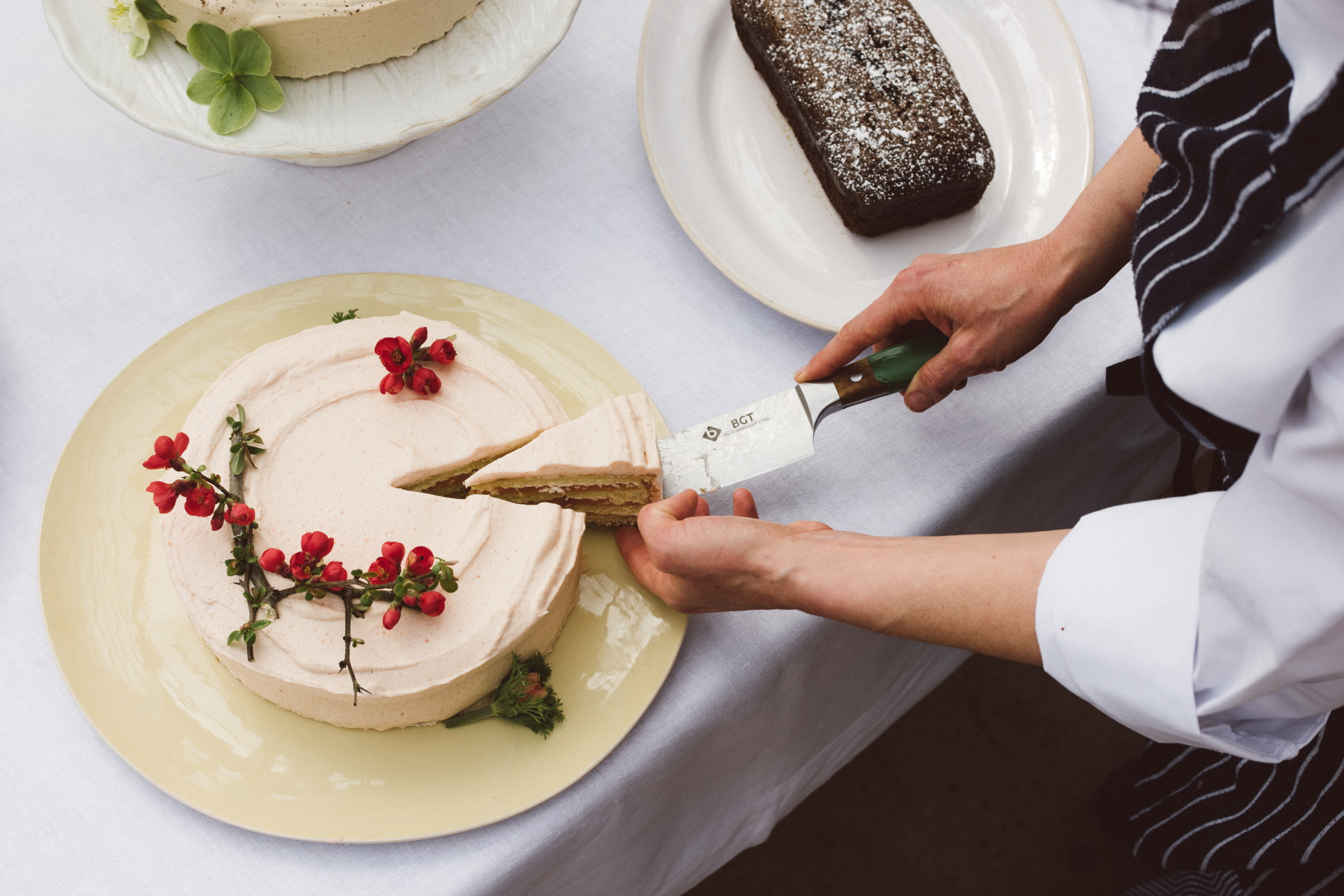 Male employee cutting into a cake