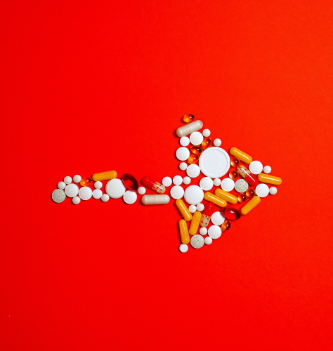 Pills arrange into an arrow